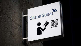 A sign of Credit Suisse bank is seen outside a branch in Geneva, on March 15, 2023. - Credit Suisse shares nosedived on on March 15, 2023, after its main shareholder said it would not provide more funding, with reassuring comments from the Swiss bank's chairman unable to calm the market panic. (Photo by Fabrice COFFRINI / AFP)