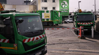 Dustbin lorries are parked at the entrance to the incineration plant at Ivry-sur-Seine, south of Paris on March 17, 2023, a day after the Paris Prefect has ordered the 