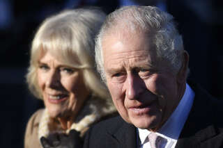 (FILES) In this file photo taken on January 20, 2023 Britain's King Charles III and Britain's Camilla, Queen Consort leave after visiting Bolton Town Hall in Bolton, north west England. - Charles III arrives in France on Sunday, March 26, for his first state visit as king, but the planned celebrations of historic cross-Channel relations face potential disruption from protests over unpopular pension reforms. (Photo by Oli SCARFF / AFP)