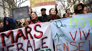 People take part in a demonstration after the government pushed a pensions reform through parliament without a vote, using the article 49.3 of the constitution, in Paris on March 28, 2023. - France faces another day of strikes and protests nearly two weeks after the president bypassed parliament to pass a pensions overhaul that is sparking turmoil in the country, with unions vowing no let-up in mass protests to get the government to back down.  The day of action is the tenth such mobilization since protests started in mid-January against the law, which includes raising the retirement age from 62 to 64. (Photo by Christophe ARCHAMBAULT / AFP)