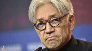 (FILES) This file photo taken on February 15, 2018 shows Japanese musician and composer Ryuichi Sakamoto, jury member of the 68th edition of the Berlinale international film festival, reacting during a press conference in Berlin. - Pioneering Japanese composer and musician Ryuichi Sakamoto has died on March 28, 2023 aged 71, after battling cancer, his management team said in a statement on April 2, 2023. (Photo by Stefanie LOOS / AFP)