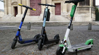 (FILES) In this file photo taken on July 23, 2020, shows Dott, TIER and Lime electric scooters in Paris, during the presentation to the press of the three companies chosen by the city council to operate free floating electric scooters in Paris for 2 years. - Voters in Paris are set to vote in a referendum on April 2, 2023, on whether to banish electric scooters for rent from the streets of the French capital, which was a pioneer in adopting the divisive new form of urban transport. (Photo by Thomas SAMSON / AFP)