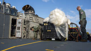 VIRGINIA BEACH, VA - FEBRUARY 10: In this U.S. Navy handout, Sailors assigned to Assault Craft Unit 4 prepare material recovered in the Atlantic Ocean from a high-altitude balloon for transport to federal agents at Joint Expeditionary Base Little Creek Feb. 10, 2023. At the direction of the President of the United States and with the full support of the Government of Canada, U.S. fighter aircraft under U.S. Northern Command authority engaged and brought down a high-altitude balloon within sovereign U.S. airspace and over U.S. territorial waters, Feb.4, 2023. Active duty, reserve, National Guard, and civilian personnel planned and executed the operation, and partners from the U.S. Coast Guard, Federal Aviation Administration, Federal Bureau of Investigation, and Naval Criminal Investigative Service (NCIS) ensured public safety throughout the operation and recovery efforts.   Ryan Seelbach/U.S. Navy via Getty Images/AFP (Photo by Handout / GETTY IMAGES NORTH AMERICA / Getty Images via AFP)