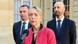 France's Prime minister Elisabeth Borne (C), flanked by France's Minister for Transformation and Public Services Stanislas Guerini (R) and France's Labour Minister Olivier Dussopt (L), addresses media following talks with inter-unions representatives at the Hotel de Matignon in Paris on April 5, 2023, after a pensions reform was pushed through parliament by the French government without a vote, using the article 49.3 of the constitution. - The inter-unions representatives, fighting against the pension reform, noted on April 5, 2023 