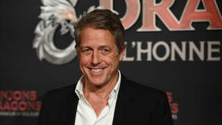 British actor Hugh Grant poses upon arrival to attend the Premiere of the film 