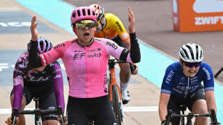 EF Education-TIBCO-SVB team's Canadian rider Alison Jackson (C) celebrates as she cycles to the finish line to win ahead of second placed Liv Racing TeqFind team's Italian rider Katia Ragusa (L) and third place Fenix-Deceuninck team's Belgian rider Marthe Truyen (R), during the third edition of the Paris-Roubaix one-day classic cycling race, between Denain and Roubaix, on April 8, 2023. (Photo by Francois LO PRESTI / AFP)