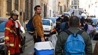 Inhabitants of the 'rue Tivoli' are evacuated after a building collapsed in the same street, in Marseille, southern France, on April 9, 2023. - 