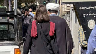A picture obtained by AFP outside Iran shows a woman walking without a head scarf in the heart of the Iranian capital Tehran, on October 11, 2022. - Iran has charged more than 100 people in two provinces over the wave of protests triggered by the death in custody last month of Mahsa Amini, the judiciary said. Amini, an Iranian of Kurdish origin, died on September 16 after falling into a coma following her arrest in Tehran by the morality police for an alleged breach of the Islamic republic's strict dress code for women. (Photo by AFP)