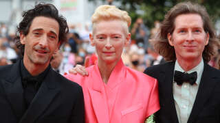 (FromL) Us actor Adrien Brody, British actress Tilda Swinton and Us director Wes Anderson pose as they arrive for the screening of the film 