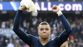 Paris Saint-Germain's French forward Kylian Mbappe celebrates his team's victory after the French L1 football match between Paris Saint-Germain (PSG) and Lille LOSC at The Parc des Princes Stadium in Paris on February 19, 2023. (Photo by FRANCK FIFE / AFP)