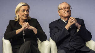France's former far-right Front National (FN) party's leader Jean-Marie Le Pen (R) and France's far-right Front National (FN) party’s leader Marine Le Pen (L), listen to a speech, on November 29, 2014 in Lyon, during the 15th French far-right National Front (FN) congress. AFP PHOTO / JEFF PACHOUD (Photo by JEFF PACHOUD / AFP)