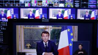 A photo of monitors in a media control room shows French President Emmanuel Macron during a televised address to the nation, made from the Elysee Palace, after signing into law a pensions reform, in Paris, on April 17, 2023. - French President Emmanuel Macron on April 15 addressed France for the first time since signing into law his controversial pension reform, facing warnings the political and social crisis it sparked is not over. Macron signed the legislation just hours after the banner change to raise the retirement age from 62 to 64 had been validated by the constitutional court on April 14, prompting accusations he was smuggling the law through in the dead of night. (Photo by Ludovic MARIN / AFP)