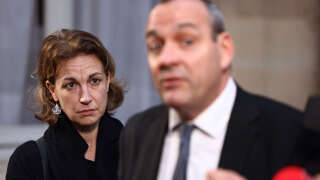 French Democratic Confederation of Labour (CFDT) deputy general secretary, Marylise Leon (L), listens to CFDT general secretary Laurent Berger (R) speeking to the press after a meeting with French Prime Minister as part of talks with unions representatives about government plans to raise the retirement age in France, at the Hotel de Matignon in Paris, on January 3, 2023. - The French government is prepared to show flexibility on a plan by President Emmanuel Macron to raise the retirement age to 65, the prime minister said on January 3, 2023, ahead of crunch talks with unions. The age of 65 is 