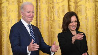 US President Joe Biden and US Vice President Kamala Harris gesture while arriving for a reception celebrating Black History Month, in the East Room of the White House in Washington, DC, on February 27, 2023. (Photo by SAUL LOEB / AFP)