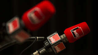 A picture taken on November 3, 2015 in Paris shows microphones bearing the logo of French radio station 