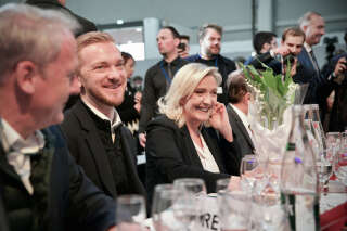 National Assembly parliamentary group President for the French far-right Rassemblement National (RN) party Marine Le Pen sits at a baquet table during the event 