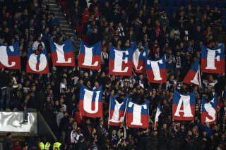 Paris Saint-Germain's ultras cheer for their team during the UEFA Champions League group A football match between Paris Saint-Germain (PSG) and Basel at the Parc des Princes stadium in Paris on October 19, 2016. (Photo by MIGUEL MEDINA / AFP)