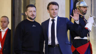 Ukraine's President Volodymyr Zelensky (C,L) is welcomed by France's President Emmanuel Macron (C,R) upon his arrival at the Elysee presidential palace in Paris on May 14, 2023. Ukraine's President Volodymyr Zelensky landed in Paris for talks with French President Emmanuel Macron, after accepting a prize for his country's fight for 
