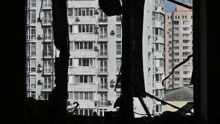 This photograph taken on May 8, 2023, shows a broken window of a heavily damage flat in the high-rise residential building damaged by remains of a shot down Russian drone in Kyiv, amid the Russian invasion of Ukraine. The Ukrainian air command said that all 35 Russian drones launched at the city had been detected and shot down, while the local military administration said at least five people were wounded, with falling debris blamed for damage in multiple areas. (Photo by Genya SAVILOV / AFP)