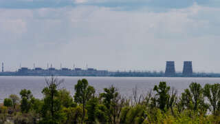ENERHODAR, UKRAINE - 2023/05/14: View of Zaporizhzhya Nuclear Power Plant from right bank of Dnipro river. At the moment the left bank of the Dnipro River is occupied by Russian forces including the nuclear plant. (Photo by Lev Radin/Pacific Press/LightRocket via Getty Images)