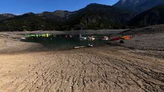 This view taken on August 25, 2022, shows the partially dried-up Serre-Ponçon lake in Ubaye Serre-Ponçon in French Alps as water level decreased 16 meters due to the drought. - The latest monthly analysis by the European Union's Global Drought Observatory (GDO) highlighted the risk of ongoing soil dryness caused by successive heatwaves and a persistent lack of rainfall as it maintained its warning issued with the previous report that nearly half of the EU's territory is at risk of drought. (Photo by JOEL SAGET / AFP) (Photo by JOEL SAGET/AFP via Getty Images)