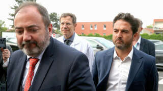 Minister for Health Francois Braun (L) and Mayor of Reims Arnaud Robinet (R) arrive at the Reims University Hospital, where a nurse and a medical secretary were injured during a knife attack by a 59-year-old man known for mental disorders, in Reims, northeastern France on May 22, 2023. A nurse is between life and death after the stabbing attack at Reims CHU (Centre hospitalier universitaire - University Hospital), the Reims public prosecutor's office said. The 59-year-old suspect was immediately arrested. (Photo by FRANCOIS NASCIMBENI / AFP)