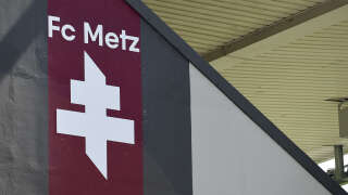 This photograph taken on August 8, 2021 shows the FC Metz new logo, displayed on the stadium before the start of the French L1 football match between FC Metz and Lille OSC at Stade Saint-Symphorien in Longeville-les-Metz, northern France. (Photo by JEAN-CHRISTOPHE VERHAEGEN / AFP)