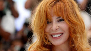 French-Canadian singer and member of the Jury of the Official Selection Mylene Farmer smiles during a photocall of the Jury at the 74th edition of the Cannes Film Festival in Cannes, southern France, on July 6, 2021. (Photo by Valery HACHE / AFP)