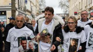 (FILES) Guy Trompat (C), father of Kevin Trompat, and mourners take part in a 'Marche Blanche' (White March) to pay tribute to youths murdered Leslie Hoorelbeke and Kevin Trompat, in Niort on March 12, 2023. Guy Trompat will appear in court in Niort on June 2, 2023, on charges of death threats and incitement to murder - he is said to have offered a sum of money to anyone who would kill the people suspected of killing his son, or their relatives. Five men suspected of having set up a deadly ambush to kill Kevin and Leslie have been indicted and imprisoned. (Photo by YOHAN BONNET / AFP)