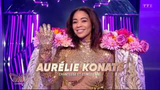 La Biche cachait finalement la chanteuse et actrice Aurélie Konaté, gagnante de la saison 2 de la « Star Academy ».