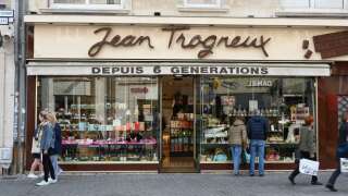 A picture shows a chocolate shop owned by French First Lady Brigitte Macron's grandnephew Jean-Baptiste Trogneux who was attacked a day before by anti-government protesters, in Amiens on May 16, 2023. The great-nephew of French First Lady Brigitte Macron, who runs the family's main chocolate shop, has been beaten up in an apparent politically motivated assault, police and family sources said on Tuesday. Local police said they had arrested eight people after the attack, which took place shortly after President Macron had appeared for an interview on the country's main TV news programme at 8:00 pm (1800 GMT) on Monday evening. (Photo by DENIS CHARLET / AFP)