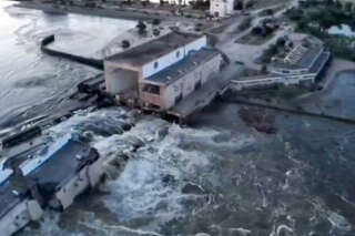 This screen grab from a video posted on Ukraine's President Volodymyr Zelensky's Twitter account on June 6, 2023 shows an aerial view of the dam of the Kakhovka Hydroelectric Power Station after it was partially destroyed. A Russian-held dam in southern Ukraine was damaged on June 6, with Kyiv and Moscow accusing each other of blowing it up while locals were forced to flee rising waters. (Photo by various sources / AFP) / -----EDITORS NOTE --- RESTRICTED TO EDITORIAL USE - MANDATORY CREDIT 