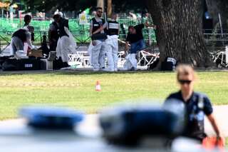 French forensic police officers work at the scene of a stabbing attack in the 'Jardins de l'Europe' park in Annecy, in the French Alps, on June 8, 2023. A Syrian refugee suspected of stabbing six people in the French Alpine town of Annecy on Thursday did not appear to have a 