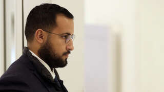 Alexandre Benalla, the former top security aide to the French President arrives at Paris courthouse, on February 19, 2019, prior to a hearing before a judge as part of the so called 