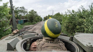 UKRAINE - 2023/05/30: A member of mortar unit of 57th artillery brigade of Ukrainian Army Forces rides on YPR-765 Dutch made armored personnel vehicle in undisclosed location near Bahmut in Donetsk region of Ukraine. (Photo by Lev Radin/Pacific Press/LightRocket via Getty Images)