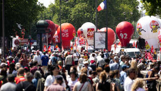 PARIS, FRANCE - 2023/06/06: Protesters seen gathering during the demonstration against the new pension reform law. French trade unions organized the 14th day of protests against Macron's new pension reform law that raises the retirement age from 62 to 64. Thousands of demonstrators took the streets all over France to protest against this polemic law. In Paris, there were some clashes between the police and protesters also some arrests, despite having been a much more peaceful day of protests compared to the previous ones. (Photo by Telmo Pinto/SOPA Images/LightRocket via Getty Images)