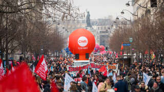 Demonstrators at a protest against government plans to revamp the pension system, in Paris, France, on Saturday, Feb. 11, 2023. Unions arranging the fourth wave of strikes are keen to build on the momentum seen during the first two calls for action last month as they try to make Macron back down on his proposal to lift the minimum retirement age to 64 from 62. Photographer: Benjamin Girette/Bloomberg via Getty Images