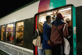 Passengers board a congested train during a national strike at Gare du Nord train station in Paris, France, on Tuesday, Oct. 18, 2022. French rail, energy and other key workers are striking to demand a bigger share of corporate profits, raising pressure on President Emmanuel Macron to take further steps to ease the impact of surging inflation. Photographer: Benjamin Girette/Bloomberg via Getty Images