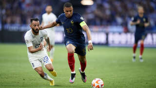 PARIS, FRANCE - JUNE 19: Emmanouil Siopis of Greece competes for the ball with Kylian Mbappe of France during the UEFA EURO 2024 qualifying round group B match between France and Greece at Stade de France on June 19, 2023 in Paris, France. (Photo by Franco Arland/Quality Sport Images/Getty Images)