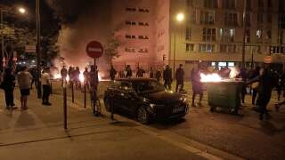 People burn rubish bins and block a street during a protest in Paris on June 29, 2023, a day after the killing of 17-year-old boy, named only as Nahel M., in Nanterre by a police officer. (Photo by Fiachra GIBBONS / AFP)