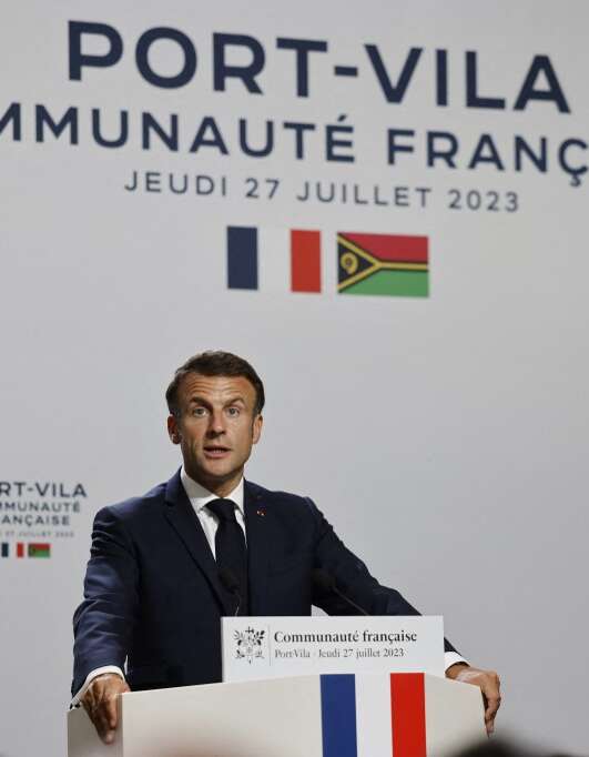 French President Emmanuel Macron addresses the French community the in Port Vila on July 27, 2023. (Photo by Ludovic MARIN / AFP)