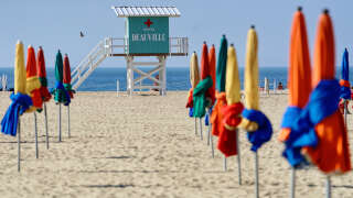 DEAUVILLE, FRANCE - SEPTEMBER 06: The lifeguards emergency first aid station is seen between on the beach the famous umbrellas (parasols) of Deauville during the 47th Deauville American Film Festival on September 06, 2021 in Deauville, France. (Photo by Sylvain Lefevre/WireImage)