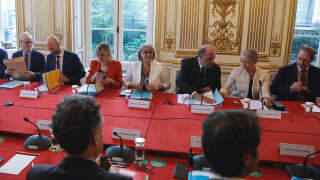 (L-R) French Minister Delegate for Parliamentary Relations Frank Riester, French Minister for Transformation and Public Services Stanislas Guerini, French Minister for Energy Transition Agnes Pannier-Runacher, French Higher Education and Research Minister Sylvie Retailleau, French Justice Minister Eric Dupond-Moretti, and French Prime Minister Elisabeth Borne, and director of cabinet Jean-Denis Compeller attend the meeting with the new government members at the Hotel de Matignon in Paris, on July 24, 2023. French President Emmanuel Macron reshuffled his government on July 20, 2023 as he looks to move on from a series of crises since his re-election last year, government sources said. After weeks of speculation that he might change prime minister, the 45-year-old head of state said on Monday that he was sticking with under-fire Elisabeth Borne. (Photo by Geoffroy VAN DER HASSELT / POOL / AFP)