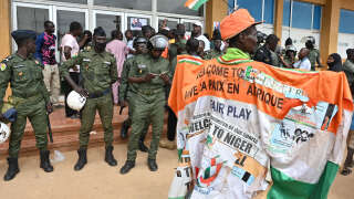 Supporters of Niger's National Council for the Safeguard of the Homeland (CNSP) demonstrate in Niamey on August 6, 2023. Thousands of supporters of the military coup in Niger gathered at a Niamey stadium Sunday, when a deadline set by the West African regional bloc ECOWAS to return the deposed President Mohamed Bazoum to power is set to expire, according to AFP journalists. A delegation of members of the ruling National Council for the Safeguard of the Homeland (CNSP) arrived at the 30,000-seat stadium to cheers from supporters, many of whom were drapped in Russian flags and portraits of CNSP leaders. (Photo by AFP)