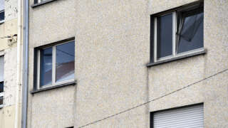 A photograph shows two windows (up) of the flat of a couple in Forbach, eastern France, on August 7, 2023, after French police said they had arrested a 55-year-old German national who is accused of holding his 53-year-old wife captive in a flat since 2011. A police source said the woman, also German, 53-year-old who had managed to call police in Germany, who in turn alerted their French colleagues, was naked with her head shaved when they found her in a bedroom in the apartment, and had multiple injuries, including broken bones. (Photo by Jean-Christophe VERHAEGEN / AFP)