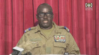 This video frame grab image obtained by AFP from ORTN - Télé Sahel on August 9, 2023 shows Colonel Major Amadou Abdramane, a CNSP (Conseil national pour la sauvegarde de la patrie) member, reading a statement on national television. Niger's military leaders accused France of breaching a ban on the country's air space, a charge that came on the eve of a West African summit following a coup two weeks earlier. 
A French military aircraft 