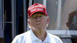 (FILES) Former US President Donald Trump looks on during Round 3 at the LIV Golf-Bedminster 2023 at the Trump National in Bedminster, New Jersey, on August 13, 2023. Prosecutors asked a judge on August 16, 2023 to set a trial date of March 4 next year for the election racketeering and conspiracy case against former president Donald Trump in the US state of Georgia. The defense is likely to push for a later start, with the 77-year-old Republican billionaire facing four criminal trials as he bids for a return to the White House (Photo by TIMOTHY A. CLARY / AFP)