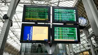 This photograph shows information pannels at Gare de Lyon in Paris, on December 2, 2022 during a strike organised by SNCF (French state rail company) controllers. Complicated weekend in perspective in French stations: a strike launched by a collective of controllers has forced the SNCF to cancel 60% of its TGV and Intercites from December 2, 2022 to December 4, 2022, and raises fears of new disruptions during the end of year celebrations year. (Photo by STEPHANE DE SAKUTIN / AFP)