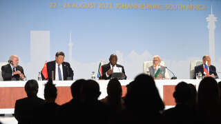 Luiz Inacio Lula da Silva, Brazil's president, Xi Jinping, China's president, Cyril Ramaphosa, South Africa's president, Narendra Modi, India's prime minister, and Sergei Lavrov, Russia's foreign minister, left to right, on the closing day of the BRICS summit at the Sandton Convention Center in the Sandton district of Johannesburg, South Africa, on Thursday, Aug. 24, 2023. Expansion of BRICS membership is top of the agenda for the summit being hosted this week by South Africa. Photographer: Leon Sadiki/Bloomberg via Getty Images