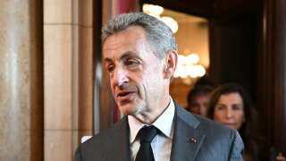 Former French President Nicolas Sarkozy leaves the courthouse after the ruling in his appeal trial in a corruption case at Paris courthouse on May 17, 2023. A French court of appeals on May 17, 2023 upheld a prison sentence of three years, including two suspended, against former president Nicolas Sarkozy for corruption and influence peddling. (Photo by bERTRAND GUAY / AFP)